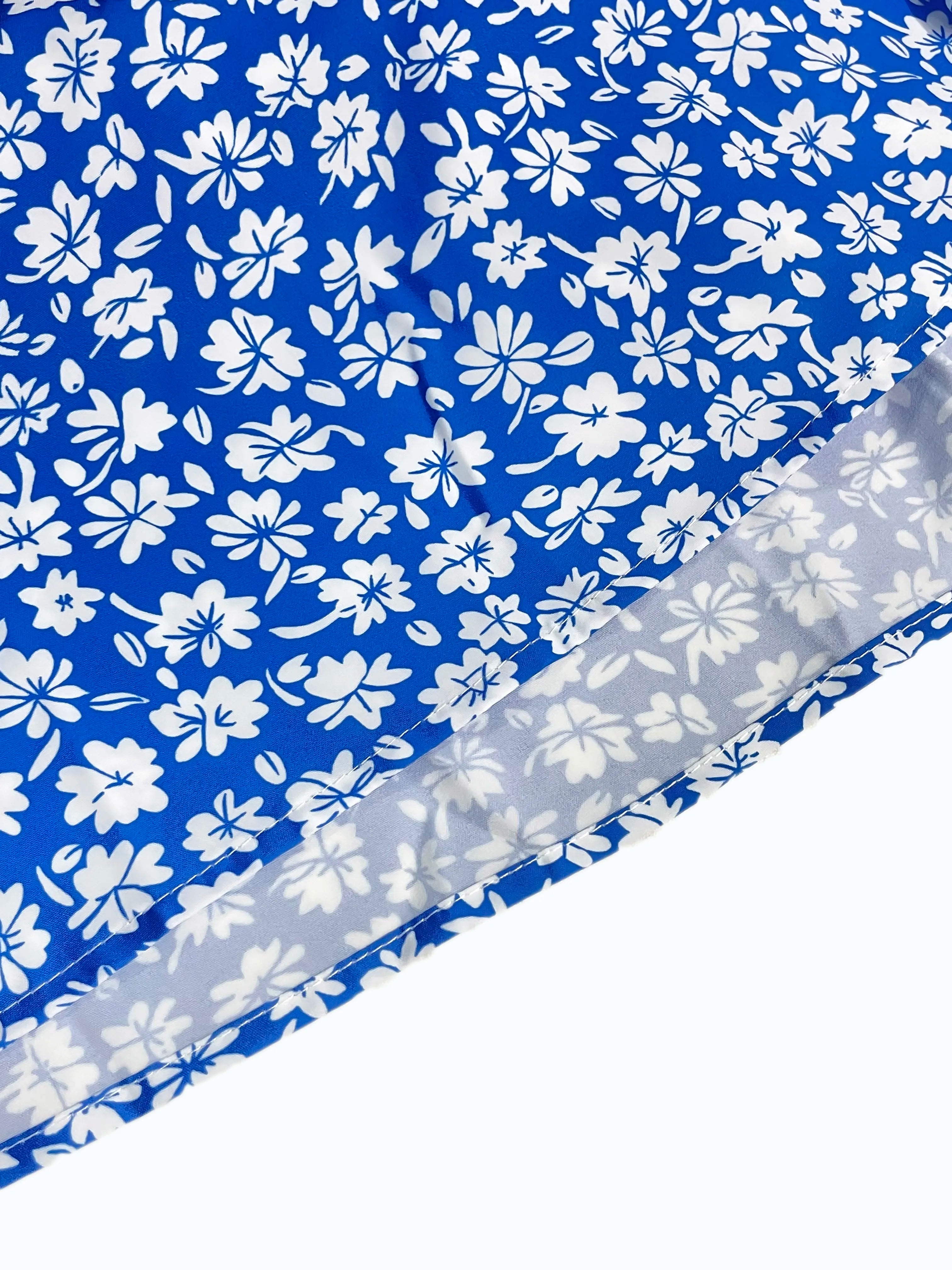 The cami dress with small flower prints a backless design and thin