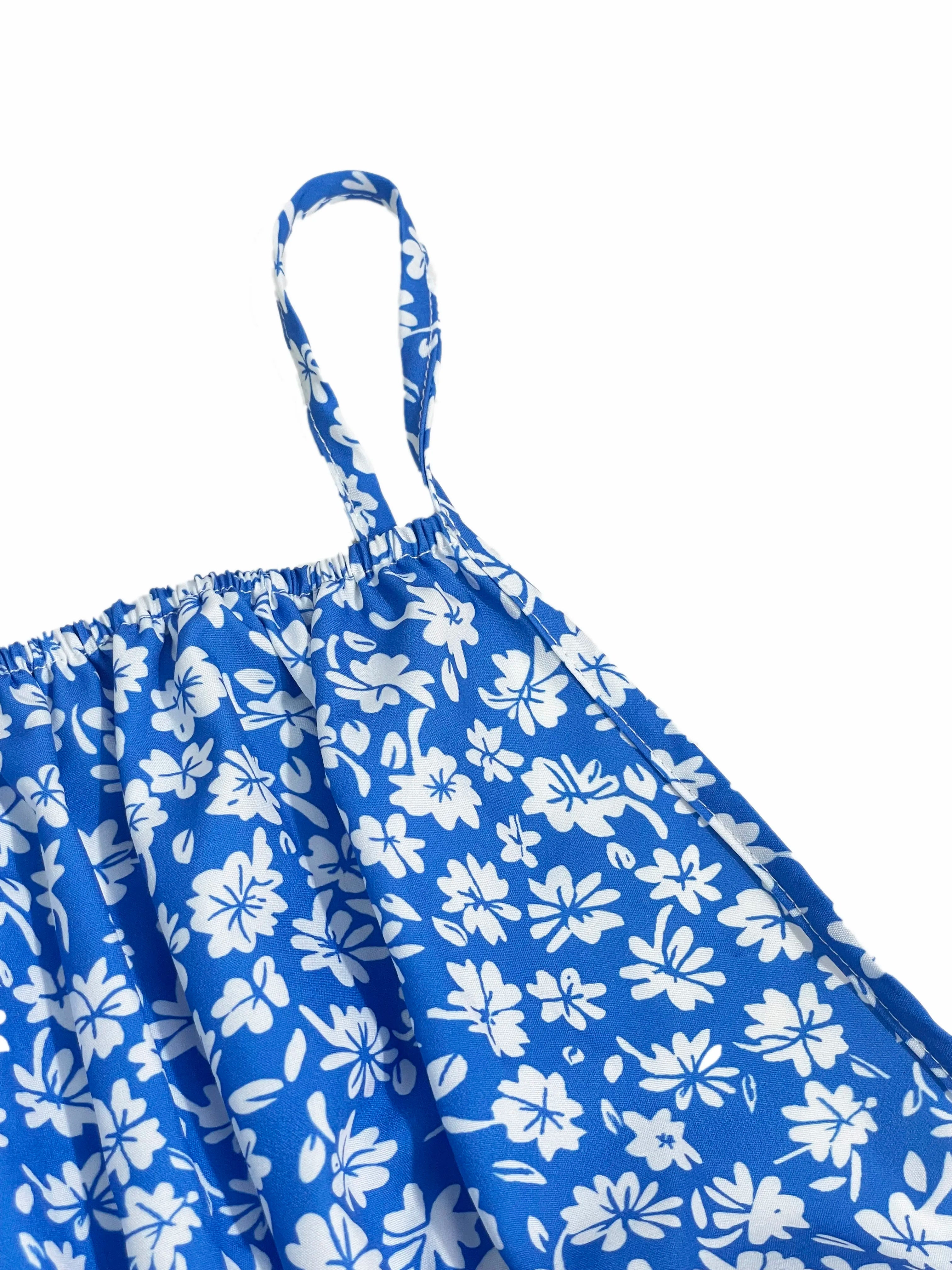 The cami dress with small flower prints a backless design and thin